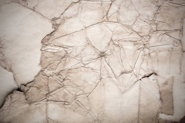 Eski kağıt çarşaf. Toz ve kirli lekelerle dolu boş bir arka plan. Eski ve antika sanat konsepti. Ayrıntılı yakın çekim stüdyo çekimi. Ön manzara. Ayarlanmış