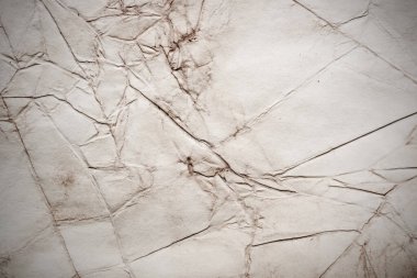 Eski kağıt çarşaf. Toz ve kirli lekelerle dolu boş bir arka plan. Eski ve antika sanat konsepti. Ayrıntılı yakın çekim stüdyo çekimi. Ön manzara. Ayarlanmış