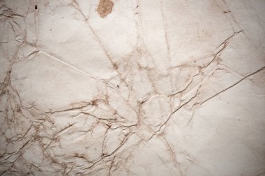 Eski kağıt çarşaf. Toz ve kirli lekelerle dolu boş bir arka plan. Eski ve antika sanat konsepti. Ayrıntılı yakın çekim stüdyo çekimi. Ön manzara. Ayarlanmış