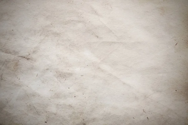 Eski kağıt çarşaf. Toz ve kirli lekelerle dolu boş bir arka plan. Eski ve antika sanat konsepti. Ayrıntılı yakın çekim stüdyo çekimi. Ön manzara. Ayarlanmış