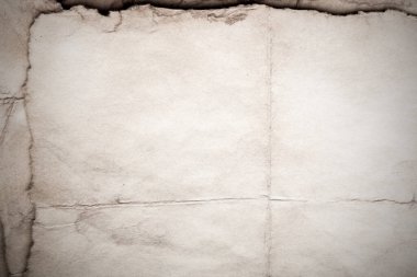 Eski kağıt çarşaf. Toz ve kirli lekelerle dolu boş bir arka plan. Eski ve antika sanat konsepti. Ayrıntılı yakın çekim stüdyo çekimi. Ön manzara. Ayarlanmış