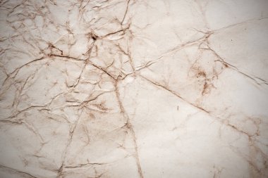 Eski kağıt çarşaf. Toz ve kirli lekelerle dolu boş bir arka plan. Eski ve antika sanat konsepti. Ayrıntılı yakın çekim stüdyo çekimi. Ön manzara. Ayarlanmış