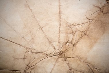 Eski kağıt çarşaf. Toz ve kirli lekelerle dolu boş bir arka plan. Eski ve antika sanat konsepti. Ayrıntılı yakın çekim stüdyo çekimi. Ön manzara. Ayarlanmış