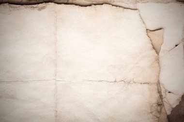 Eski kağıt çarşaf. Toz ve kirli lekelerle dolu boş bir arka plan. Eski ve antika sanat konsepti. Ayrıntılı yakın çekim stüdyo çekimi. Ön manzara. Ayarlanmış