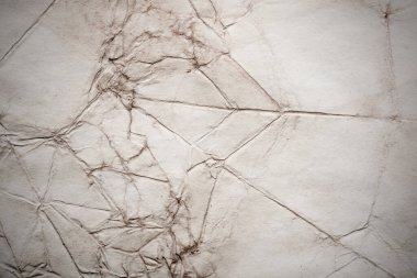 Eski kağıt çarşaf. Toz ve kirli lekelerle dolu boş bir arka plan. Eski ve antika sanat konsepti. Ayrıntılı yakın çekim stüdyo çekimi. Ön manzara. Ayarlanmış