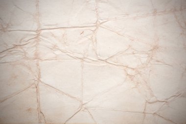 Eski kağıt çarşaf. Toz ve kirli lekelerle dolu boş bir arka plan. Eski ve antika sanat konsepti. Ayrıntılı yakın çekim stüdyo çekimi. Ön manzara. Ayarlanmış