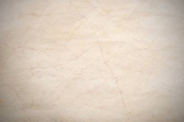 Eski kağıt çarşaf. Toz ve kirli lekelerle dolu boş bir arka plan. Eski ve antika sanat konsepti. Ayrıntılı yakın çekim stüdyo çekimi. Ön manzara. Ayarlanmış