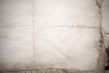 Eski kağıt çarşaf. Toz ve kirli lekelerle dolu boş bir arka plan. Eski ve antika sanat konsepti. Ayrıntılı yakın çekim stüdyo çekimi. Ön manzara. Ayarlanmış