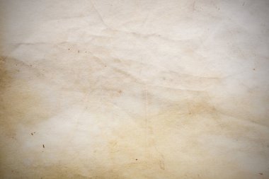 Eski kağıt çarşaf. Toz ve kirli lekelerle dolu boş bir arka plan. Eski ve antika sanat konsepti. Ayrıntılı yakın çekim stüdyo çekimi. Ön manzara. Ayarlanmış