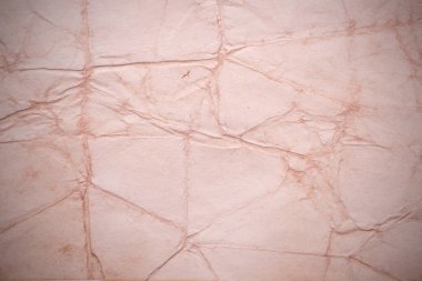 Eski kağıt çarşaf. Toz ve kirli lekelerle dolu boş bir arka plan. Eski ve antika sanat konsepti. Ayrıntılı yakın çekim stüdyo çekimi. Ön manzara. Ayarlanmış