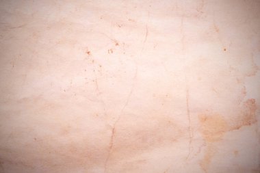 Eski kağıt çarşaf. Toz ve kirli lekelerle dolu boş bir arka plan. Eski ve antika sanat konsepti. Ayrıntılı yakın çekim stüdyo çekimi. Ön manzara. Ayarlanmış