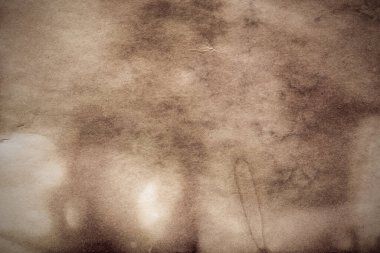 Eski kağıt çarşaf. Toz ve kirli lekelerle dolu boş bir arka plan. Eski ve antika sanat konsepti. Ayrıntılı yakın çekim stüdyo çekimi. Ön manzara. Ayarlanmış