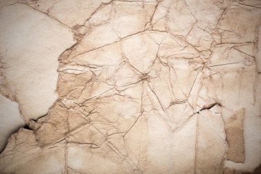 Eski kağıt çarşaf. Toz ve kirli lekelerle dolu boş bir arka plan. Eski ve antika sanat konsepti. Ayrıntılı yakın çekim stüdyo çekimi. Ön manzara. Ayarlanmış