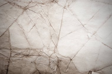 Eski kağıt çarşaf. Toz ve kirli lekelerle dolu boş bir arka plan. Eski ve antika sanat konsepti. Ayrıntılı yakın çekim stüdyo çekimi. Ön manzara. Ayarlanmış