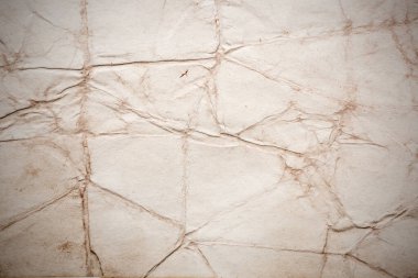 Eski kağıt çarşaf. Toz ve kirli lekelerle dolu boş bir arka plan. Eski ve antika sanat konsepti. Ayrıntılı yakın çekim stüdyo çekimi. Ön manzara. Ayarlanmış