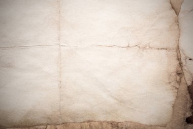 Eski kağıt çarşaf. Toz ve kirli lekelerle dolu boş bir arka plan. Eski ve antika sanat konsepti. Ayrıntılı yakın çekim stüdyo çekimi. Ön manzara. Ayarlanmış