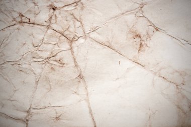 Eski kağıt çarşaf. Toz ve kirli lekelerle dolu boş bir arka plan. Eski ve antika sanat konsepti. Ayrıntılı yakın çekim stüdyo çekimi. Ön manzara. Ayarlanmış