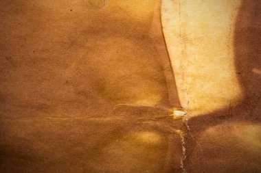 Eski kağıt çarşaf. Toz ve kirli lekelerle dolu boş bir arka plan. Eski ve antika sanat konsepti. Ayrıntılı yakın çekim stüdyo çekimi. Ön manzara. Ayarlanmış