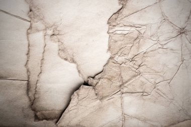 Eski kağıt çarşaf. Toz ve kirli lekelerle dolu boş bir arka plan. Eski ve antika sanat konsepti. Ayrıntılı yakın çekim stüdyo çekimi. Ön manzara. Ayarlanmış