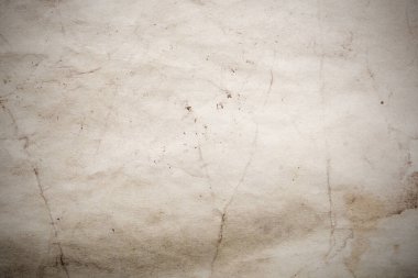 Eski kağıt çarşaf. Toz ve kirli lekelerle dolu boş bir arka plan. Eski ve antika sanat konsepti. Ayrıntılı yakın çekim stüdyo çekimi. Ön manzara. Ayarlanmış