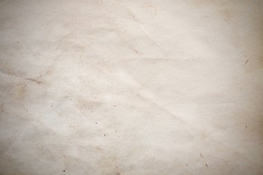 Eski kağıt çarşaf. Toz ve kirli lekelerle dolu boş bir arka plan. Eski ve antika sanat konsepti. Ayrıntılı yakın çekim stüdyo çekimi. Ön manzara. Ayarlanmış