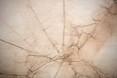 Eski kağıt çarşaf. Toz ve kirli lekelerle dolu boş bir arka plan. Eski ve antika sanat konsepti. Ayrıntılı yakın çekim stüdyo çekimi. Ön manzara. Ayarlanmış