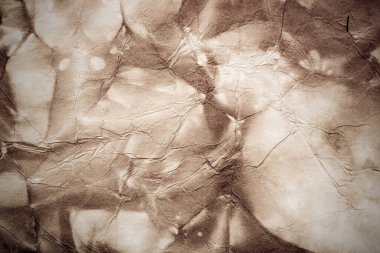 Eski kağıt çarşaf. Toz ve kirli lekelerle dolu boş bir arka plan. Eski ve antika sanat konsepti. Ayrıntılı yakın çekim stüdyo çekimi. Ön manzara. Ayarlanmış