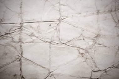 Eski kağıt çarşaf. Toz ve kirli lekelerle dolu boş bir arka plan. Eski ve antika sanat konsepti. Ayrıntılı yakın çekim stüdyo çekimi. Ön manzara. Ayarlanmış