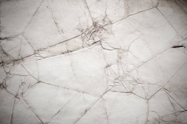 Eski kağıt çarşaf. Toz ve kirli lekelerle dolu boş bir arka plan. Eski ve antika sanat konsepti. Ayrıntılı yakın çekim stüdyo çekimi. Ön manzara. Ayarlanmış