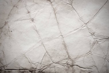 Eski kağıt çarşaf. Toz ve kirli lekelerle dolu boş bir arka plan. Eski ve antika sanat konsepti. Ayrıntılı yakın çekim stüdyo çekimi. Ön manzara. Ayarlanmış