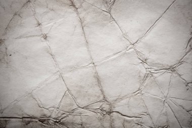 Eski kağıt çarşaf. Toz ve kirli lekelerle dolu boş bir arka plan. Eski ve antika sanat konsepti. Ayrıntılı yakın çekim stüdyo çekimi. Ön manzara. Ayarlanmış