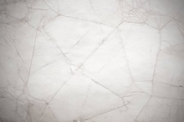 Eski kağıt çarşaf. Toz ve kirli lekelerle dolu boş bir arka plan. Eski ve antika sanat konsepti. Ayrıntılı yakın çekim stüdyo çekimi. Ön manzara. Ayarlanmış