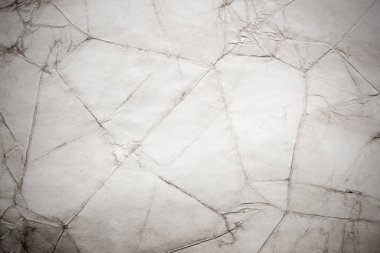 Eski kağıt çarşaf. Toz ve kirli lekelerle dolu boş bir arka plan. Eski ve antika sanat konsepti. Ayrıntılı yakın çekim stüdyo çekimi. Ön manzara. Ayarlanmış