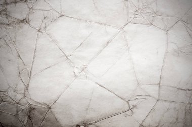 Eski kağıt çarşaf. Toz ve kirli lekelerle dolu boş bir arka plan. Eski ve antika sanat konsepti. Ayrıntılı yakın çekim stüdyo çekimi. Ön manzara. Ayarlanmış