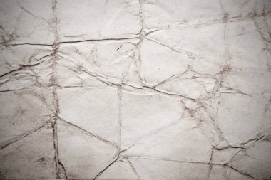 Eski kağıt çarşaf. Toz ve kirli lekelerle dolu boş bir arka plan. Eski ve antika sanat konsepti. Ayrıntılı yakın çekim stüdyo çekimi. Ön manzara. Ayarlanmış