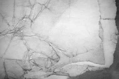 Eski kağıt çarşaf. Toz ve kirli lekelerle dolu boş bir arka plan. Eski ve antika sanat konsepti. Ayrıntılı yakın çekim stüdyo çekimi. Ön manzara. Ayarlanmış