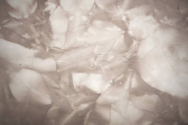 Eski kağıt çarşaf. Toz ve kirli lekelerle dolu boş bir arka plan. Eski ve antika sanat konsepti. Ayrıntılı yakın çekim stüdyo çekimi. Ön manzara. Ayarlanmış