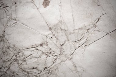 Eski kağıt çarşaf. Toz ve kirli lekelerle dolu boş bir arka plan. Eski ve antika sanat konsepti. Ayrıntılı yakın çekim stüdyo çekimi. Ön manzara. Ayarlanmış