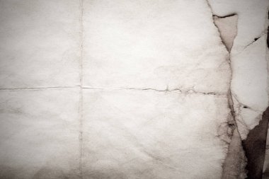 Eski kağıt çarşaf. Toz ve kirli lekelerle dolu boş bir arka plan. Eski ve antika sanat konsepti. Ayrıntılı yakın çekim stüdyo çekimi. Ön manzara. Ayarlanmış