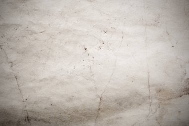 Eski kağıt çarşaf. Toz ve kirli lekelerle dolu boş bir arka plan. Eski ve antika sanat konsepti. Ayrıntılı yakın çekim stüdyo çekimi. Ön manzara. Ayarlanmış