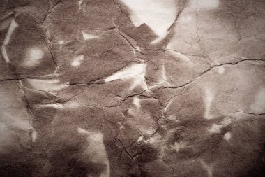 Eski kağıt çarşaf. Toz ve kirli lekelerle dolu boş bir arka plan. Eski ve antika sanat konsepti. Ayrıntılı yakın çekim stüdyo çekimi. Ön manzara. Ayarlanmış