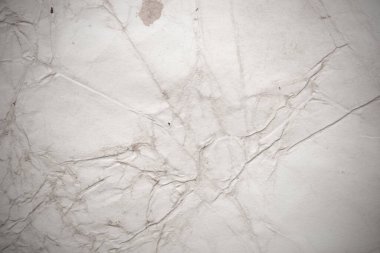 Eski kağıt çarşaf. Toz ve kirli lekelerle dolu boş bir arka plan. Eski ve antika sanat konsepti. Ayrıntılı yakın çekim stüdyo çekimi. Ön manzara. Ayarlanmış