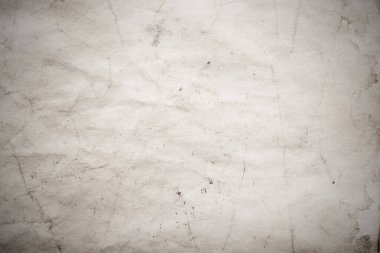 Eski kağıt çarşaf. Toz ve kirli lekelerle dolu boş bir arka plan. Eski ve antika sanat konsepti. Ayrıntılı yakın çekim stüdyo çekimi. Ön manzara. Ayarlanmış
