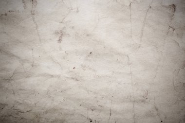 Eski kağıt çarşaf. Toz ve kirli lekelerle dolu boş bir arka plan. Eski ve antika sanat konsepti. Ayrıntılı yakın çekim stüdyo çekimi. Ön manzara. Ayarlanmış