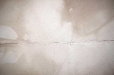 Eski kağıt çarşaf. Toz ve kirli lekelerle dolu boş bir arka plan. Eski ve antika sanat konsepti. Ayrıntılı yakın çekim stüdyo çekimi. Ön manzara. Ayarlanmış