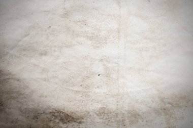 Eski kağıt çarşaf. Toz ve kirli lekelerle dolu boş bir arka plan. Eski ve antika sanat konsepti. Ayrıntılı yakın çekim stüdyo çekimi. Ön manzara. Ayarlanmış