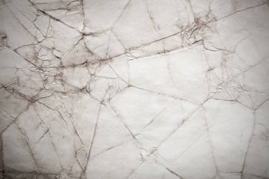 Eski kağıt çarşaf. Toz ve kirli lekelerle dolu boş bir arka plan. Eski ve antika sanat konsepti. Ayrıntılı yakın çekim stüdyo çekimi. Ön manzara. Ayarlanmış