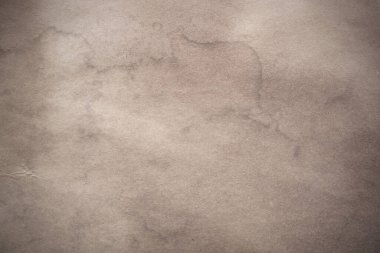 Eski kağıt çarşaf. Toz ve kirli lekelerle dolu boş bir arka plan. Eski ve antika sanat konsepti. Ayrıntılı yakın çekim stüdyo çekimi. Ön manzara. Ayarlanmış