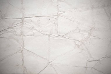 Eski kağıt çarşaf. Toz ve kirli lekelerle dolu boş bir arka plan. Eski ve antika sanat konsepti. Ayrıntılı yakın çekim stüdyo çekimi. Ön manzara. Ayarlanmış