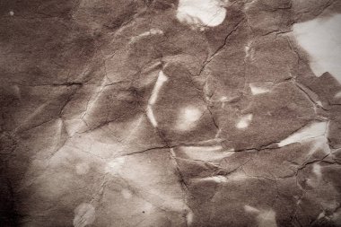 Eski kağıt çarşaf. Toz ve kirli lekelerle dolu boş bir arka plan. Eski ve antika sanat konsepti. Ayrıntılı yakın çekim stüdyo çekimi. Ön manzara. Ayarlanmış